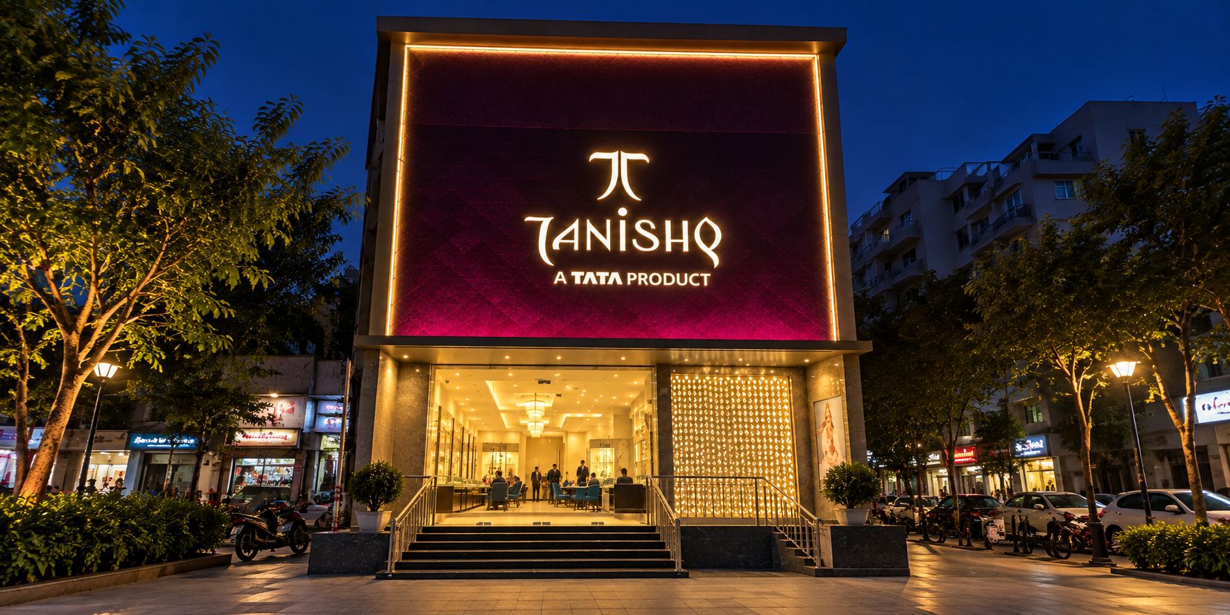 Tanishq jewellery storefront at night